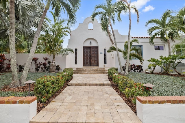 entrance to property featuring french doors