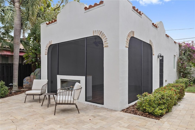 exterior space with an outdoor fireplace