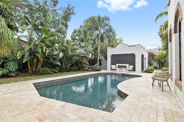 view of swimming pool featuring a patio area