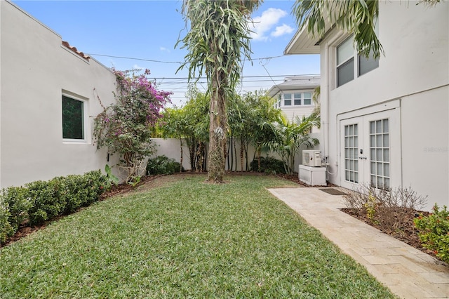 view of yard featuring french doors