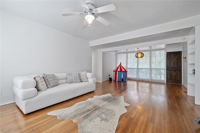 living room with ceiling fan and hardwood / wood-style floors