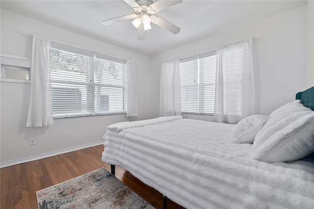 bedroom with hardwood / wood-style flooring and ceiling fan