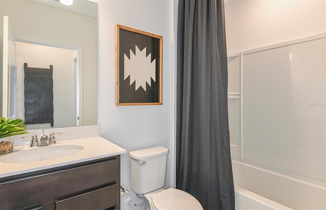 full bathroom featuring shower / bath combination with curtain, vanity, and toilet