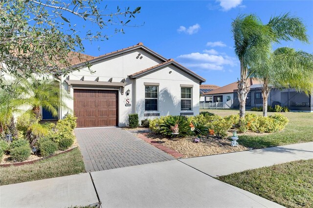 view of front of house featuring a front yard and a garage