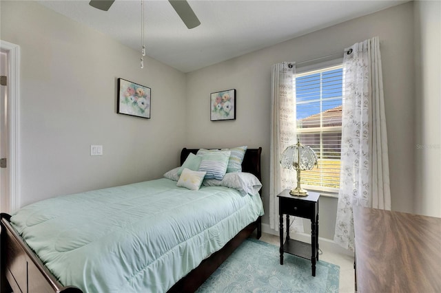 bedroom featuring ceiling fan and multiple windows