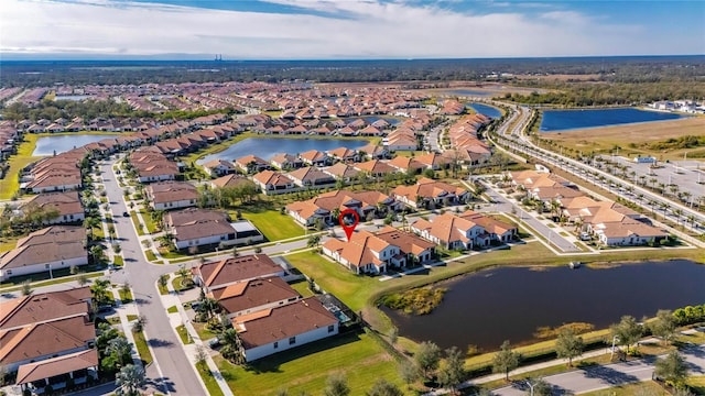 drone / aerial view with a water view