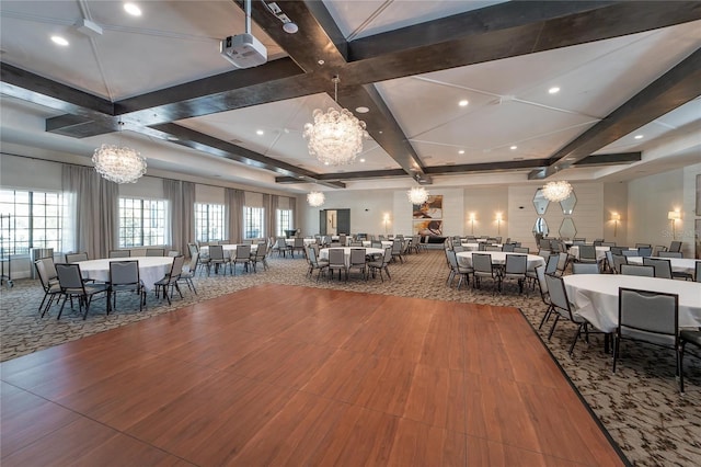 dining area featuring coffered ceiling and a chandelier