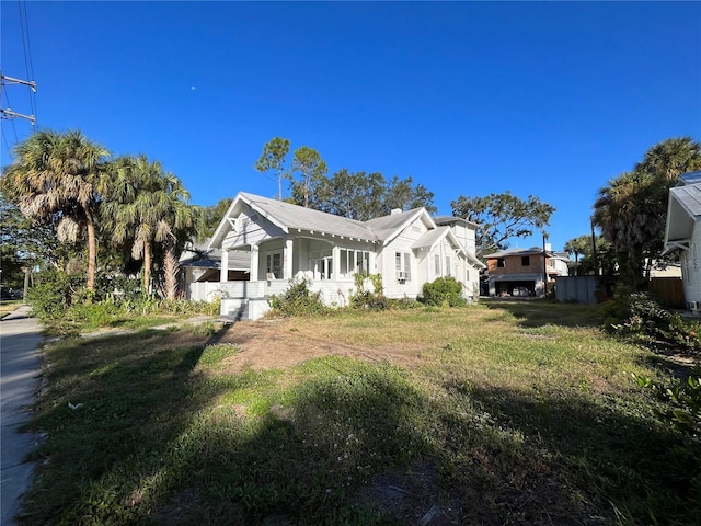 view of property exterior with a yard