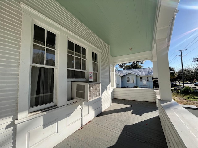 wooden deck featuring covered porch