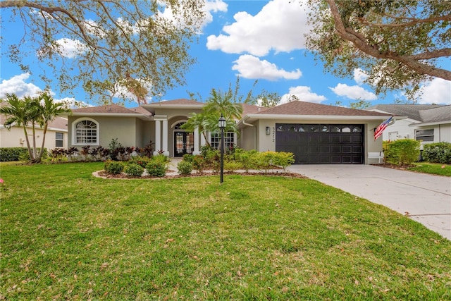 single story home with a front lawn and a garage