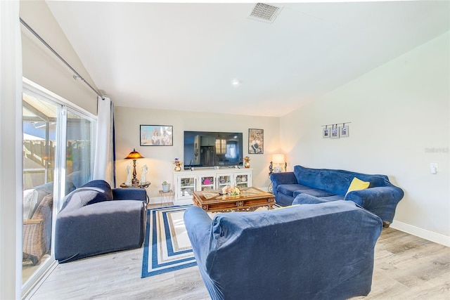 living room with light hardwood / wood-style floors