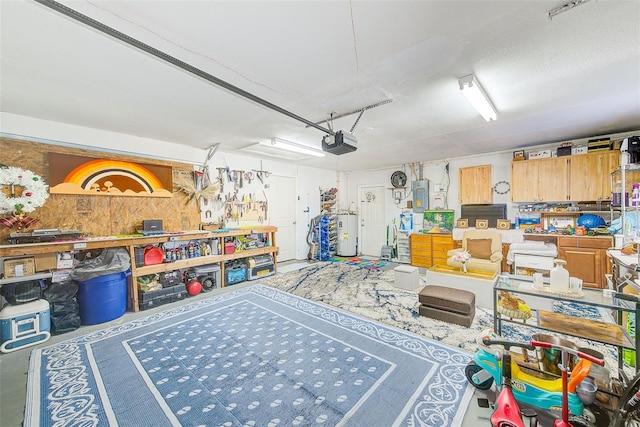 recreation room featuring a workshop area, electric panel, water heater, and a textured ceiling