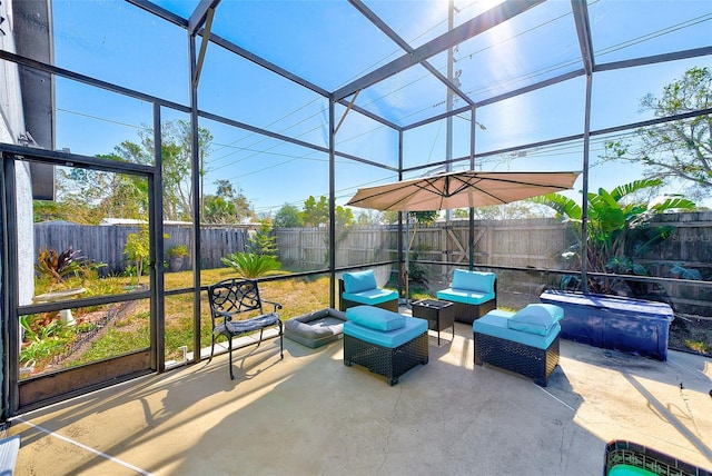 view of patio with a lanai, an outdoor hangout area, and a jacuzzi