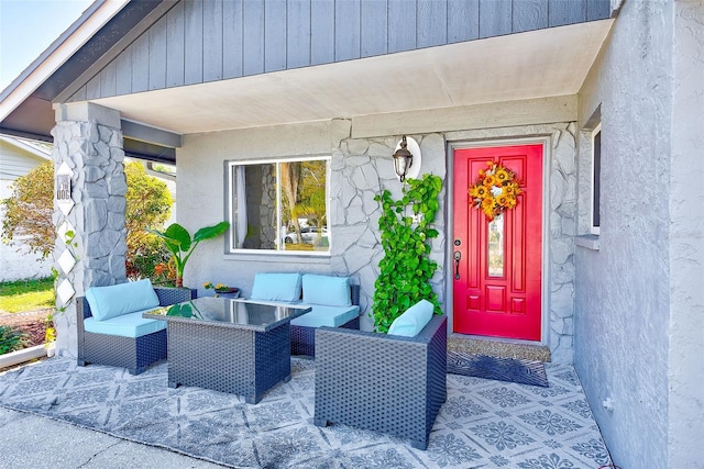 doorway to property featuring an outdoor living space