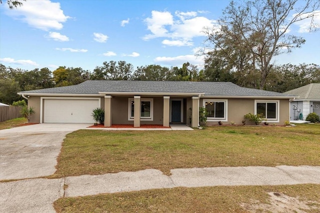 single story home featuring a front yard and a garage