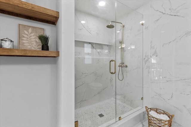 bathroom featuring an enclosed shower