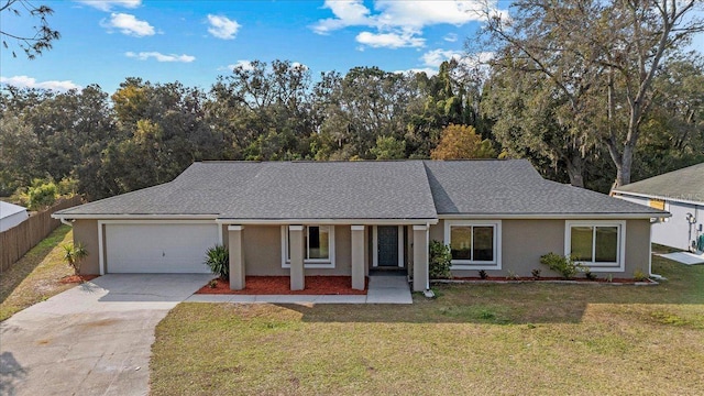 ranch-style home with stucco siding, a front lawn, fence, concrete driveway, and an attached garage