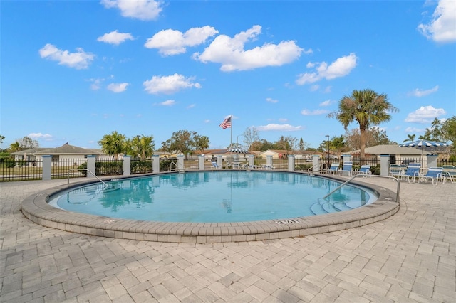 view of swimming pool with a patio