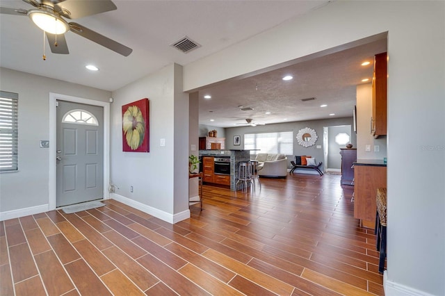 foyer featuring hardwood / wood-style flooring and ceiling fan