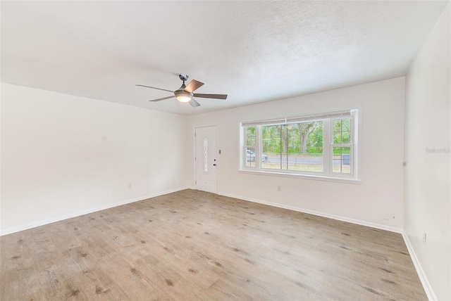 spare room with ceiling fan and a textured ceiling