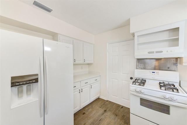 kitchen featuring white cabinetry, wood-type flooring, and white appliances