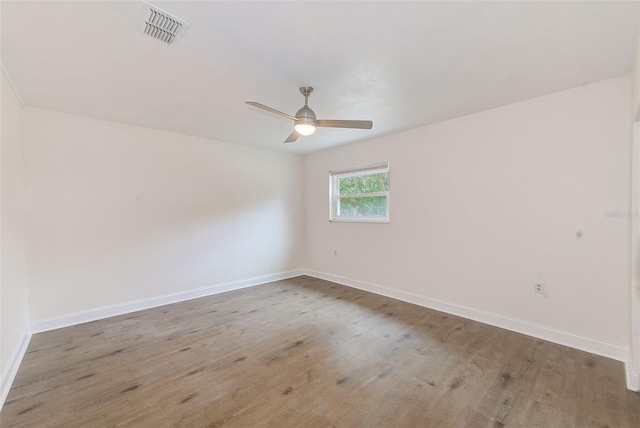 unfurnished room featuring ceiling fan and hardwood / wood-style floors