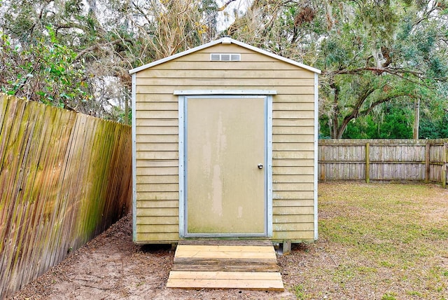 view of outdoor structure with a yard