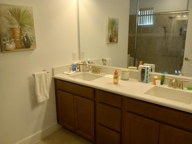 bathroom featuring vanity and a shower with shower door