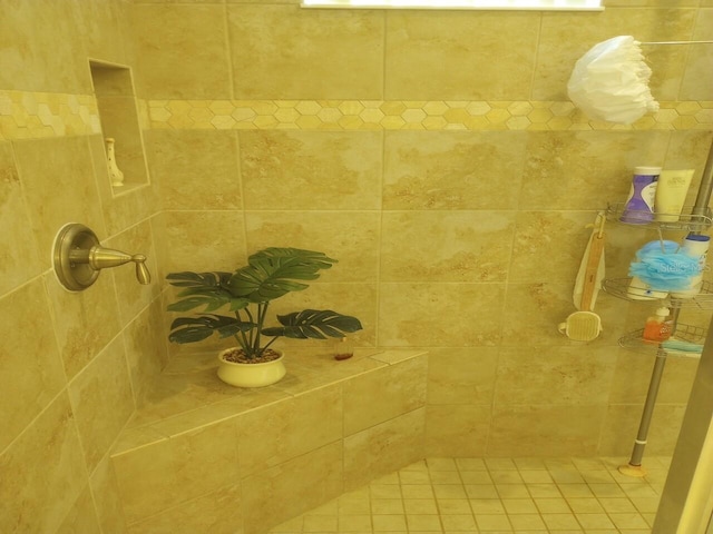 bathroom with a tile shower