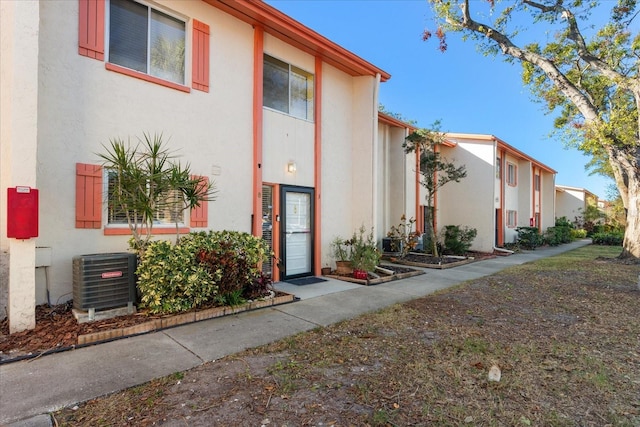 view of property with central air condition unit