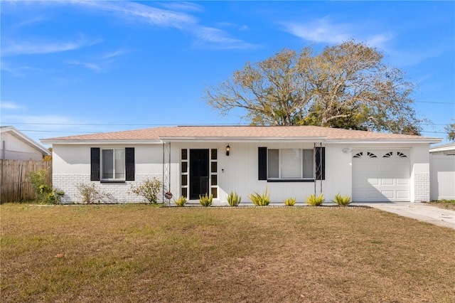 ranch-style home featuring a garage and a front yard