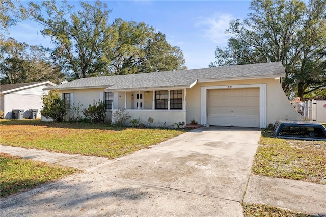 ranch-style house with a front lawn and a garage