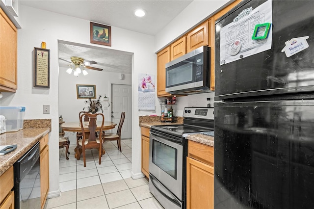 kitchen with black appliances, ceiling fan, light stone counters, and light tile patterned floors