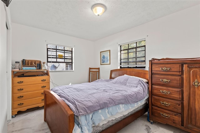 bedroom featuring a textured ceiling