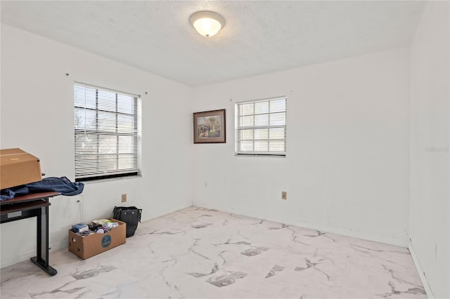 spare room with plenty of natural light