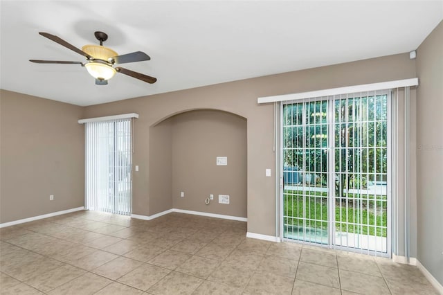 unfurnished room featuring ceiling fan and light tile patterned flooring