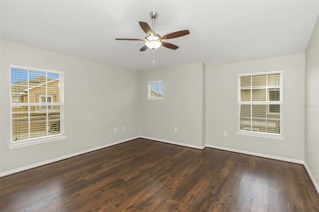 unfurnished room with ceiling fan and dark hardwood / wood-style floors