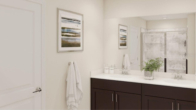 bathroom with vanity and a shower with shower door