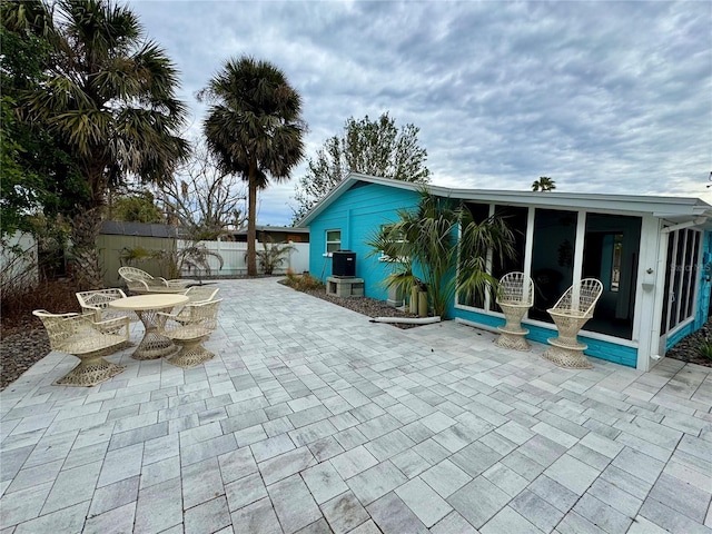 view of patio / terrace with a sunroom