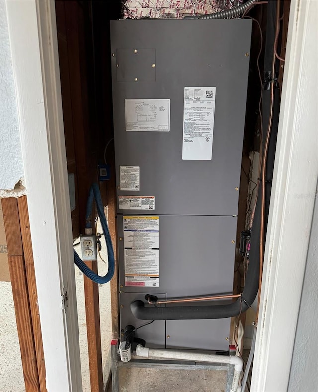 utility room featuring heating unit