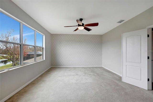 carpeted empty room with ceiling fan