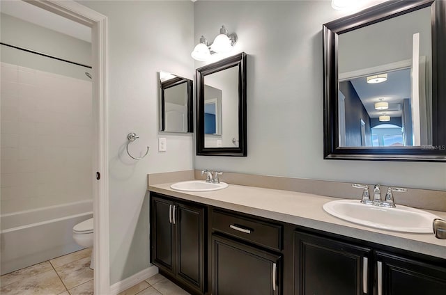 full bathroom with bathing tub / shower combination, toilet, vanity, and tile patterned flooring