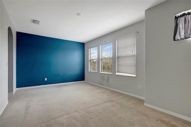 spare room with light colored carpet