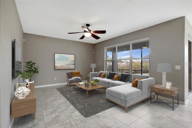 tiled living room with ceiling fan