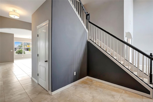 staircase with tile patterned flooring