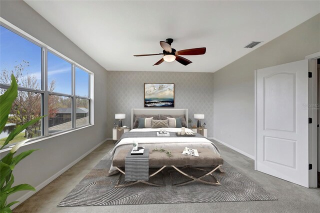 bedroom with ceiling fan and carpet floors