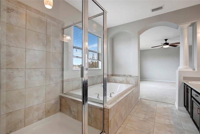 bathroom featuring decorative columns, ceiling fan, tile patterned flooring, shower with separate bathtub, and vanity