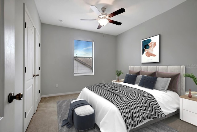 carpeted bedroom featuring ceiling fan