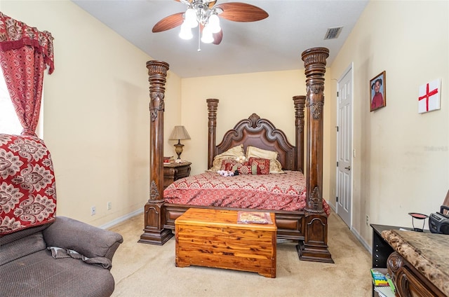 bedroom with ceiling fan and light carpet