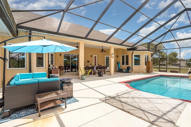 view of swimming pool featuring ceiling fan, an outdoor living space, a patio, and glass enclosure